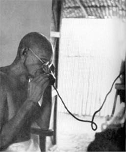 Gandhi at the telephone, Segaon, 1939