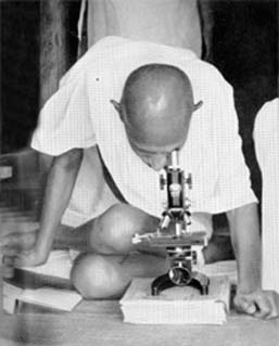 Studying Leprosy germs, Segaon, December 1939