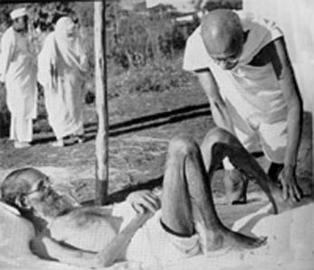 Gandhi nursing the leper patient Parchure Shastri, Segaon, December 1939