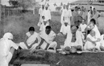 At the marriage ceremony of a Harijan couple from Malabar in front of Gandhi's hut, Sevagram, September 6, 1940
